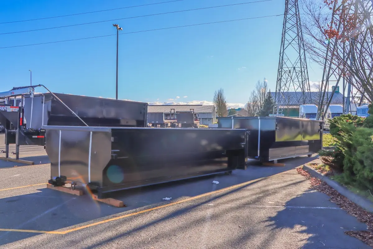 Roll-off dumpster ready for waste disposal at job site for Concrete Dumpster Rental in Parkland